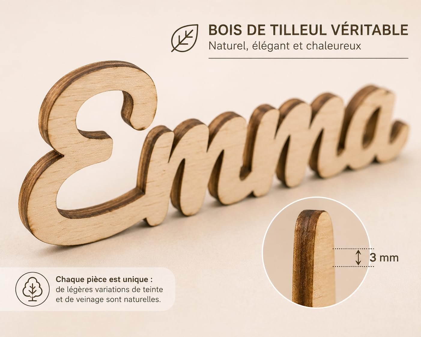 Gros plan sur le prénom Emma découpé dans le bois de tilleul, avec le détail de l’épaisseur de 3 mm